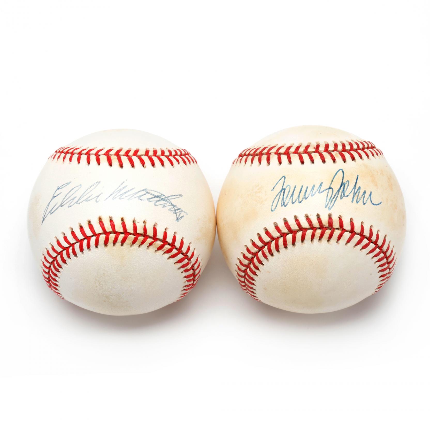 two-autographed-baseballs-tommy-john-and-eddie-mathews