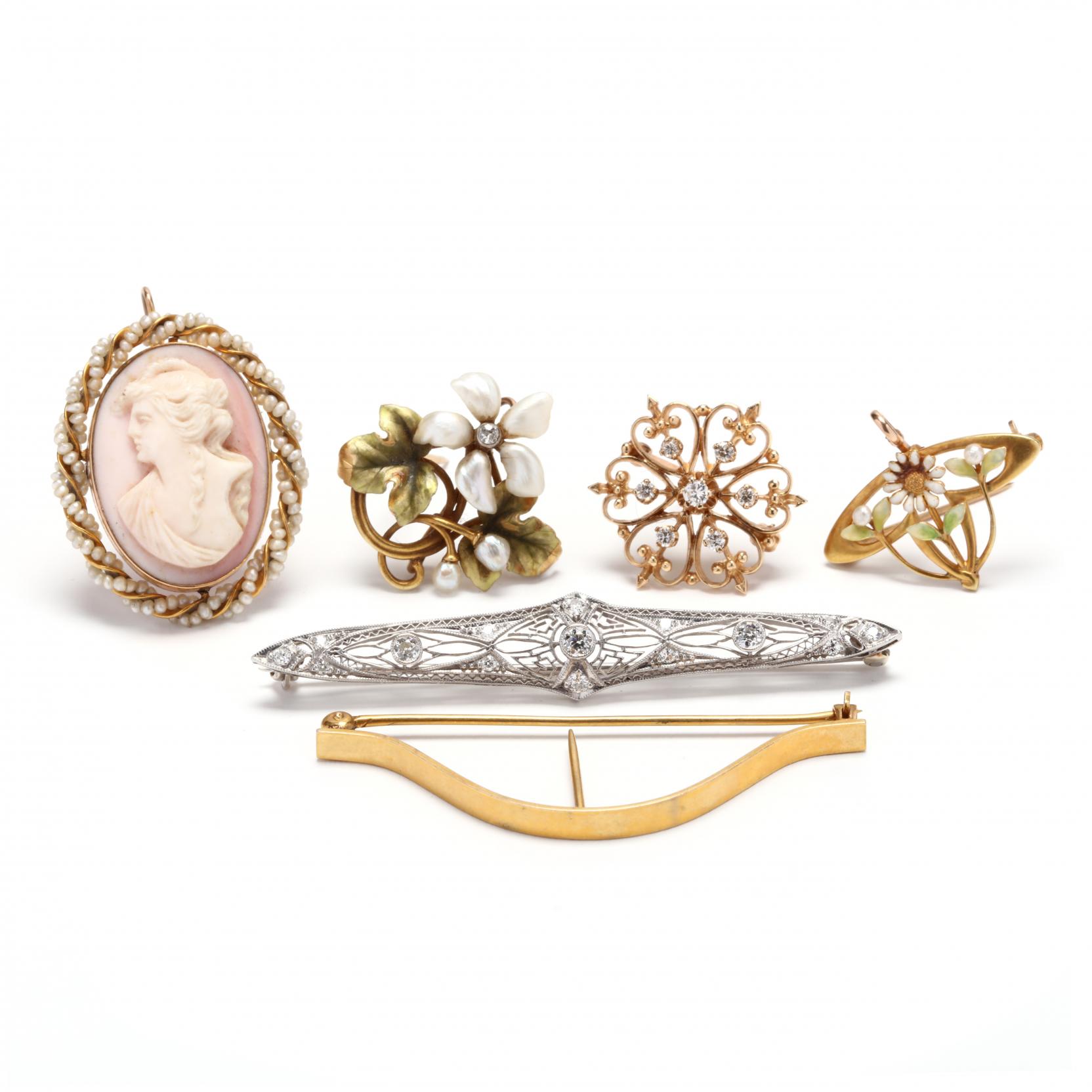 group-of-brooches-and-a-scarf-clip