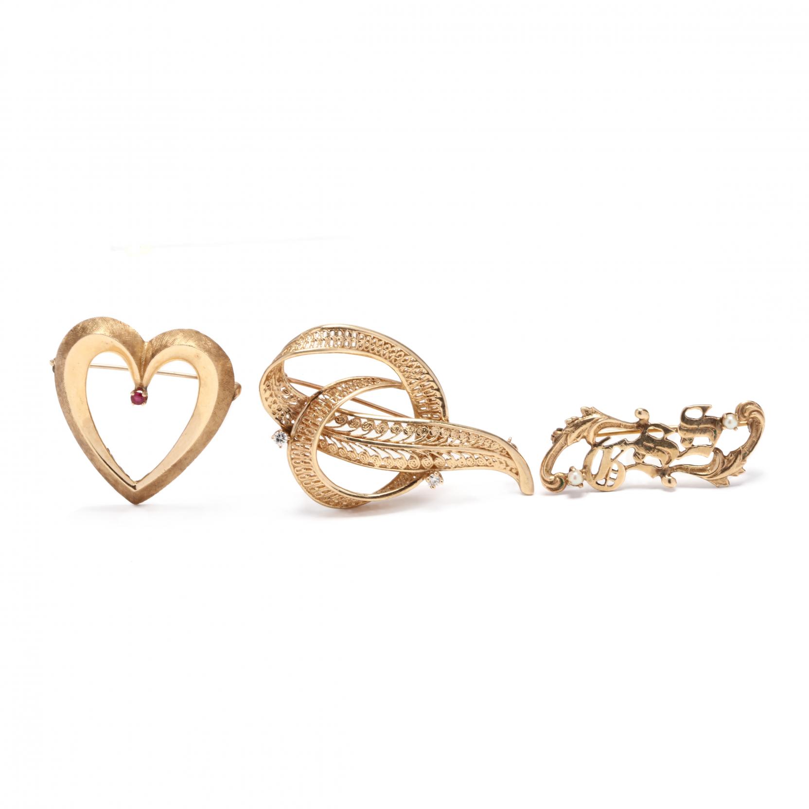 three-gold-brooches